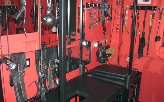BDSM Sex Toy Dungeon A red sex toy dungeon used for kinky bdsm acts with various sex toys