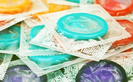 Condoms close-up of pile of condoms in various colors