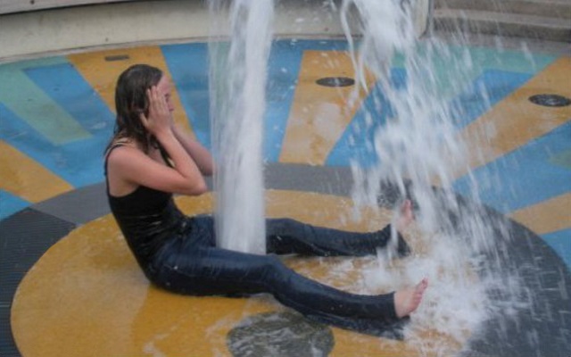 girl squirting fountain girl sitting over a gushing fountain that makes her look like she is squirting