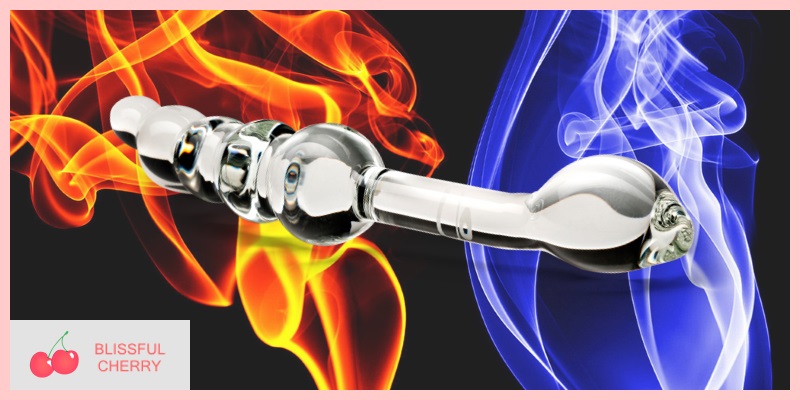 Sex Toy Temperature Play A metal sex toy over a fiery and cooling background
