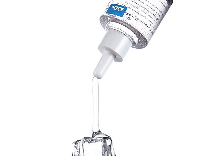 Example of Water-Based Lube Water-based lube pouring out of bottle with white background