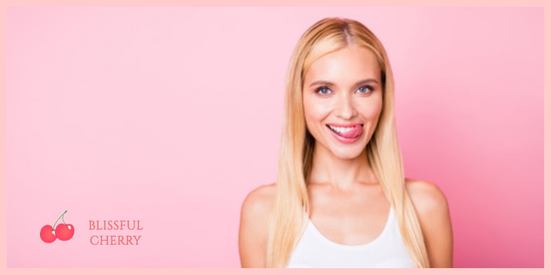 What does cum taste like? Woman smiling and licking her lips