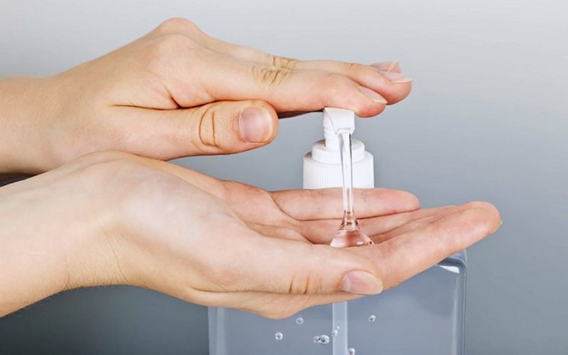 Woman dispensing sex lube into hands Close up of woman dispensing sex lube into her hands